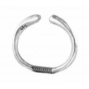 Silver bangle with spring closure